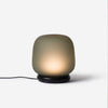 The shade is crafted from hand-blown frosted glass and the base is made from solid marble. A dimmable LED light source means the lamp creates a subtle, sophisticated glow.