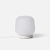The shade is crafted from hand-blown frosted glass and the base is made from solid marble. A dimmable LED light source means the lamp creates a subtle, sophisticated glow.