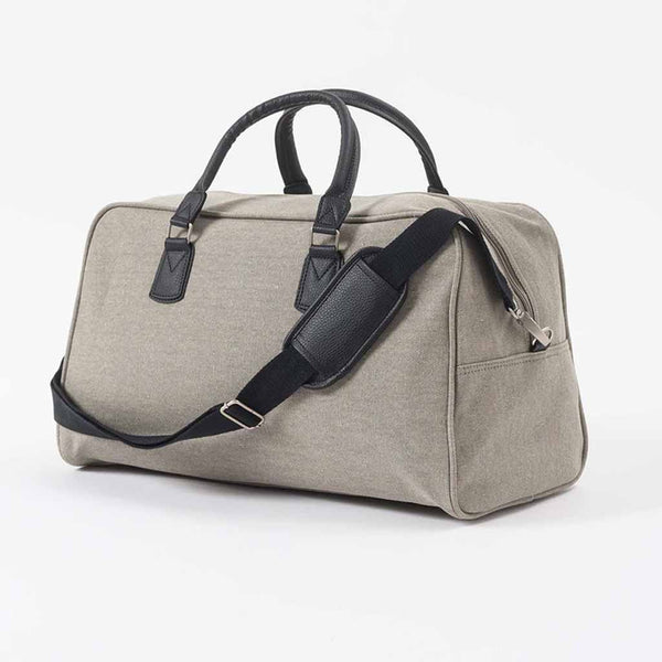 This Canvas Bag is a travel essential, it's a compact, structured design featuring robust handles and a comfy shoulder strap.
