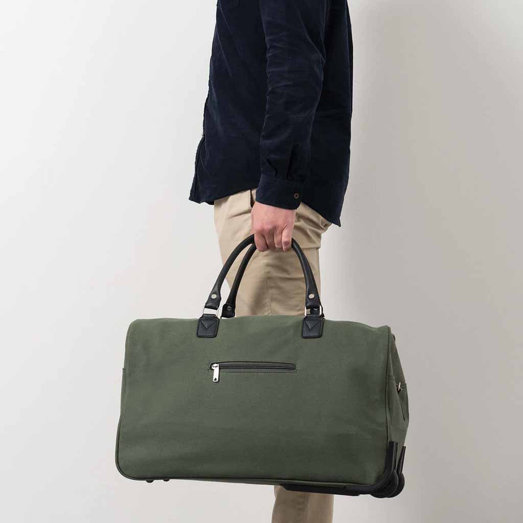 The practical Canvas Trolley Bag features an extendable handle, durable design and overhead locker friendly dimensions.