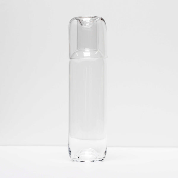 The Capsule carafe is made in Kristina Dams' Studio based in Copenhagen, Denmark. The unique "capsule" design leaves an air bubble in the middle of the glass - this serves both as a characteristic design feature and as a glass cork for the Carafe. Handmade, please expect small differences in shape. 