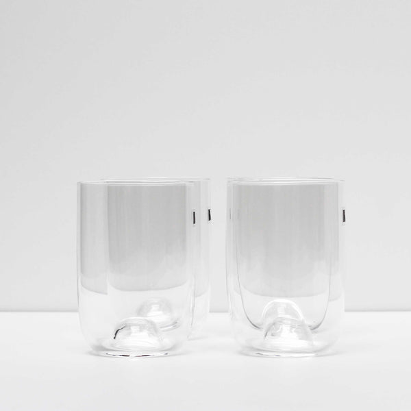 The Capsule Glass Set is made in Kristina Dams' Studio based in Copenhagen, Denmark. The unique "capsule" design leaves an air bubble in the middle of the glass - this serves both as a characteristic design feature and as a glass cork for the Carafe. Handmade, please expect small differences in shape. 