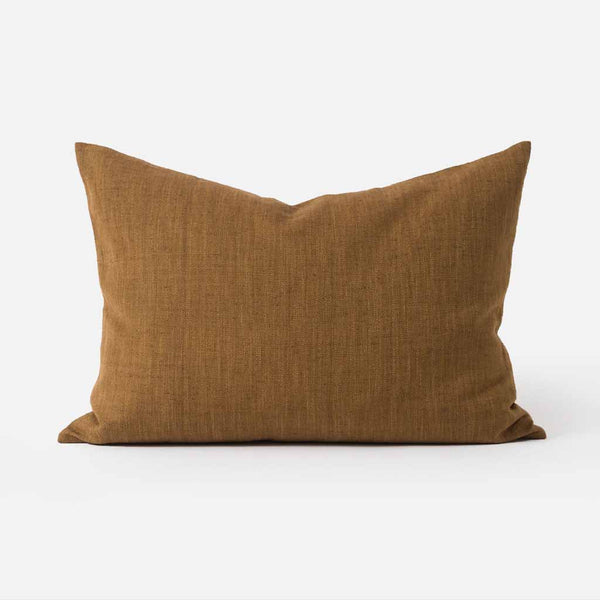 The Amano Cushion Cover is a delightfully reversable two-toned piece that celebrates warming tones and abundant texture.