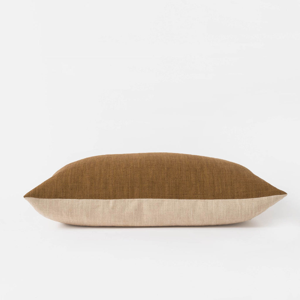 The Amano Cushion Cover is a delightfully reversable two-toned piece that celebrates warming tones and abundant texture.