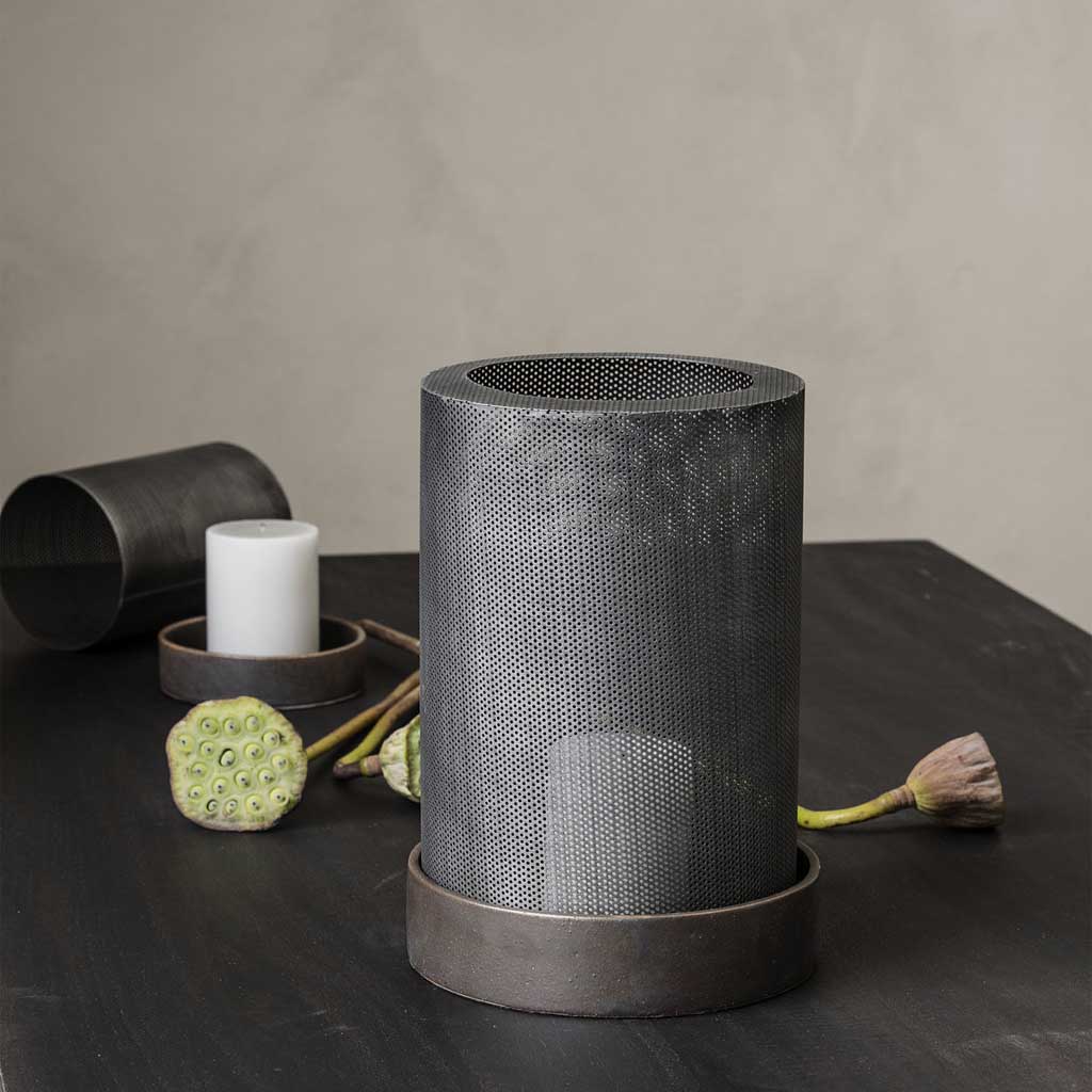 These lanterns will set the mood and create a soft warmth in the minimalist or modern space. The combination of steel and ceramic offers a refined industrial look whilst still creating a beautiful soft light.