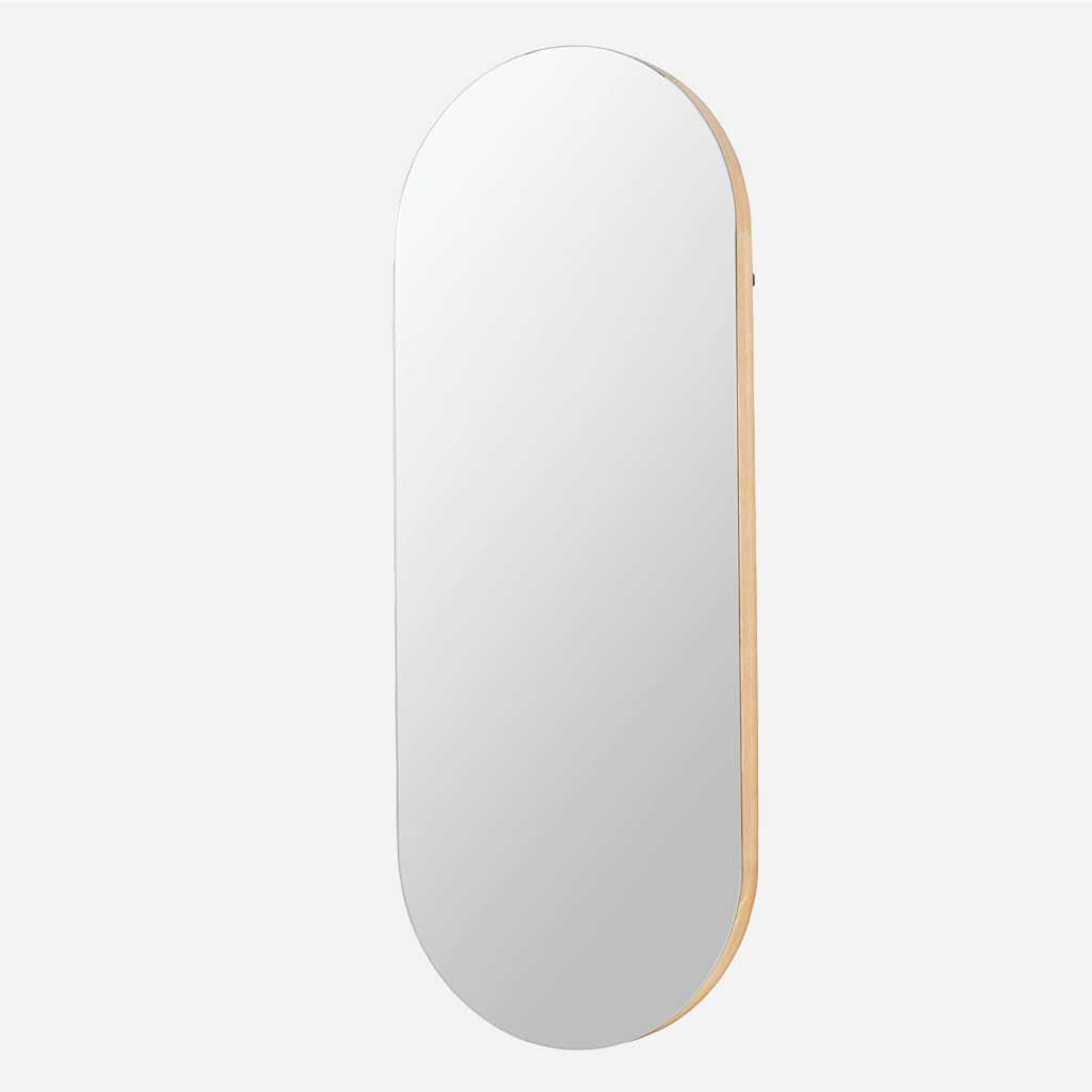 Beautiful oval mirror with subtle oak frame and slimline design, a sleek and minimalist addition to the hallway or bedroom.