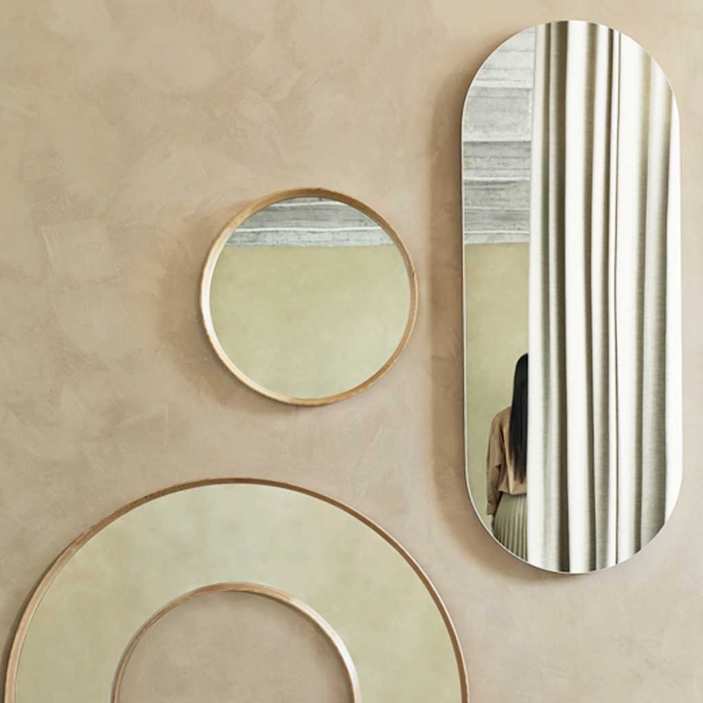 Beautiful oval mirror with subtle oak frame and slimline design, a sleek and minimalist addition to the hallway or bedroom.